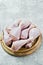 Raw chicken legs. Gray background, side view, space for text.