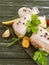 Raw chicken legs, lemon, garlic, cuisine parsley gastronomy dinner ingredient prepare on a black wooden background