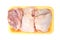 Raw chicken legs in a pack isolated on white background. Top view. Chicken thighs for cooking.