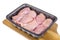 Raw chicken meat in black tray, spices.