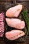 Raw chicken meat fillet on wooden background