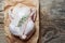 Raw chicken meat with rosemary on wooden board ready for cook. Rustic background. Food Kitchen Cuisine Health concept. Diet meal