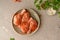 Raw chicken in a plate. Marinated meat, with oregano, herbs and paprika. Raw chicken legs, step by step cooking. Top view, gray