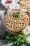 Raw Chickpeas in bowl. Nutritious food.  Healthy and vegetarian food. Gray background. Top view