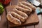 Raw chorizos on a cuting board , typical Argentine sausages made with mixed pork and beef meat