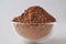 Raw cocoa Theobroma cacao powder in a glass bowl,