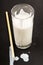 Raw and cold kefir drink in a glass with straw