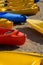 Raw of colourful canoes on beach