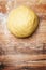 Raw cookie dough ball on wooden table, concept bakery background