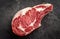 Raw cowboy steak on stone background, prime rib eye