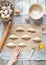 Raw croissants on parchment, preparation process.