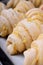 Raw croissants of yeast dough with cheese