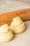 raw cruffins before baking in the oven. puff pastry like a muffin rolled into a roll. modern baking. close-up, space for text.