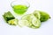 Raw cucumber along with some aloe vera gel well mixed in a glass bowl isolated on white entire ingredients.Used to rejuvenate your