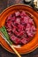 Raw diced deer steak for a venison goulash. Dark background. Top view