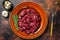 Raw diced deer steak for a venison goulash. Dark background. Top view