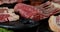 Raw different types of meat on the table with rosemary.