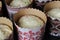 Raw dough with candied fruits for Easter cakes in paper tins, ready for baking