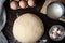 Raw dough and ingridients, food flat lay on kitchen table background