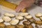 Raw dough in tartlet tins on baking tray. Uncooked pie crust in tartlet tins on a baking tray