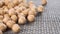 Raw dried chickpeas on a plastic kitchen mat close-up.