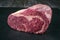 Raw dry aged Kobe Entrecote Steak Roast offered on a black board