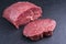 Raw dry aged wagyu beef rump steak slice and piece on black background