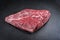 Raw dry aged wagyu cap of rump beef on black background