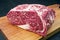 Raw dry aged wagyu entrecote beef steak roast on a modern design wooden board