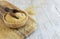 Raw Dry bulgur wheat grain in a wooden bowl with a scoop close up, copy space