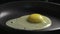 Raw egg fall on frying pan for cooking in 180fps slow motion