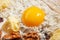 Raw egg, flour, walnut, raisins, butter. Baking background