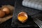 Raw egg in its shell on a slate background