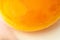 Raw egg yolk close-up as background