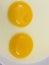 Raw egg yolks in a plate
