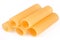 Raw and empty cannelloni tubes on a white background