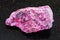 raw Eudialyte stone on dark background