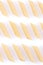 Raw feathers macaroni. Italian pasta close up on the white background