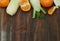 Raw Fennel Vegetable and Oranges over Wooden Background. Copy Space.