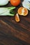 Raw Fennel Vegetable and Oranges over Wooden Background. Copy Space.