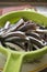 Raw fillets of anchovies in a colander