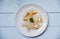 Raw fish fillet piece with lemon on white plate - Close up pangasius dolly fish meat