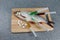 Raw fish, not cooked. White fish on a cutting Board riddled with