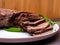 raw five pork or beef tongues with green onion, on wooden background gourment food conception, selective focus