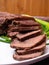 raw five pork or beef tongues with green onion, on wooden background gourment food conception, selective focus