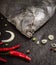 Raw flounder head with spices on dark stone background