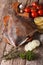 raw flounder with ingredients on a cutting board close-up. vertical