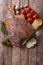 Raw flounder with ingredients on a table. vertical top view