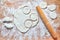 Raw floured dough on wooden table