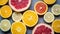 raw food: slicing citrus fruits. Orange, tangerine, lemon lime grapefruit